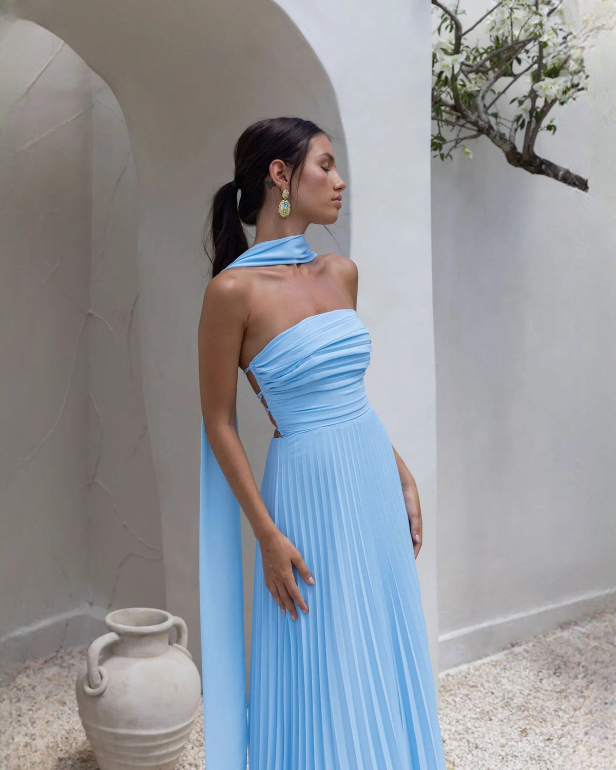 Blue strapless chiffon A-line maxi dress with ruched neckline and open lace-up back