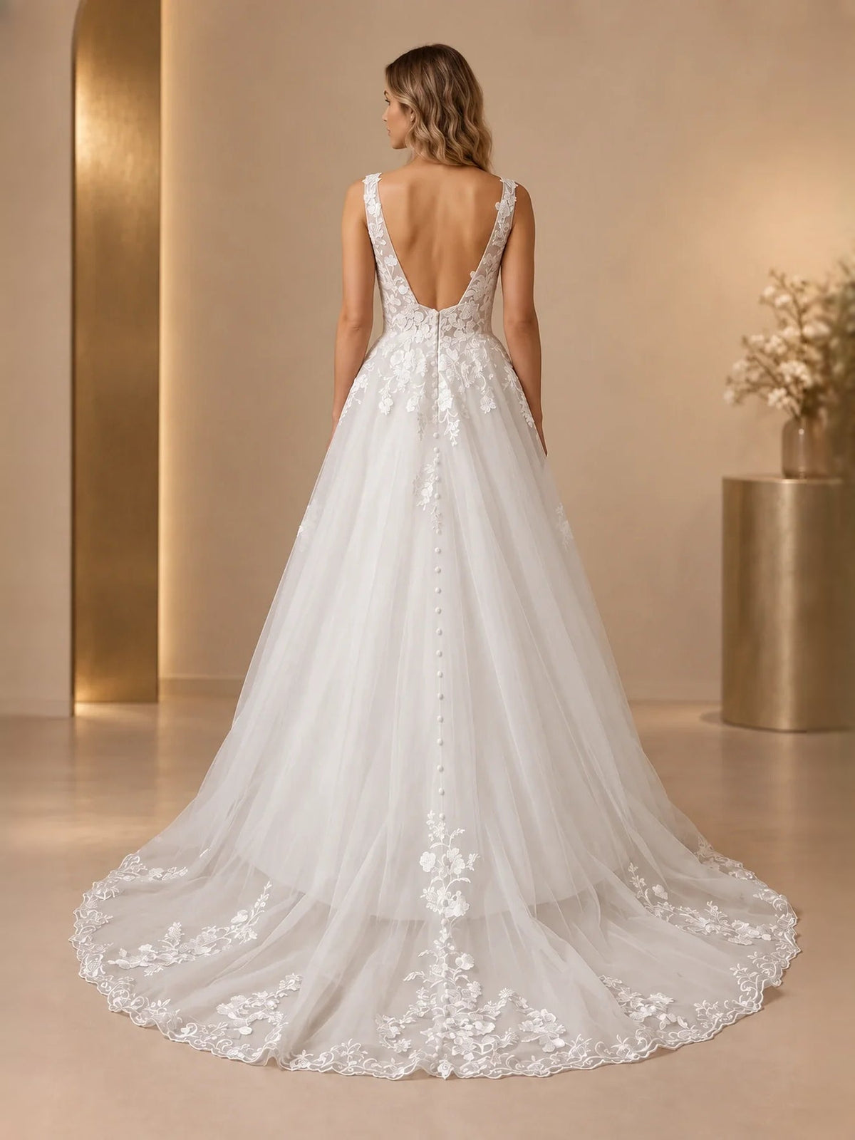 Ivory sleeveless A-line wedding dress with V-neck and floral applique, open-back