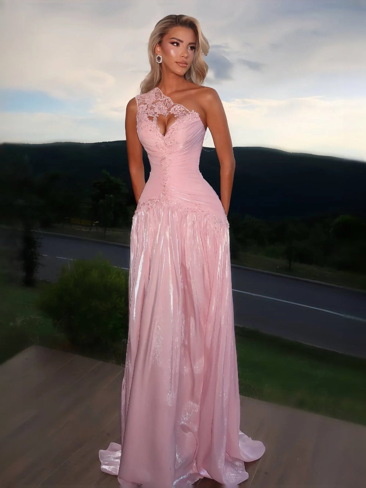 Pink one-shoulder floor-length prom dress with floral applique and ruched bodice