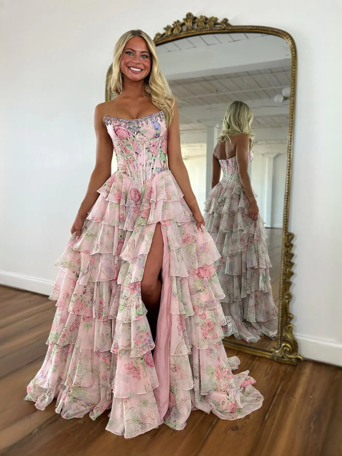 Pink floral corset-style sweetheart A-line prom dress with tiered ruffles and side slit