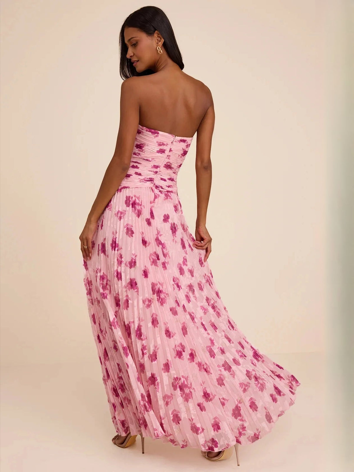 Dusty pink floral chiffon maxi dress with ruched bodice and A-line pleated skirt, back view