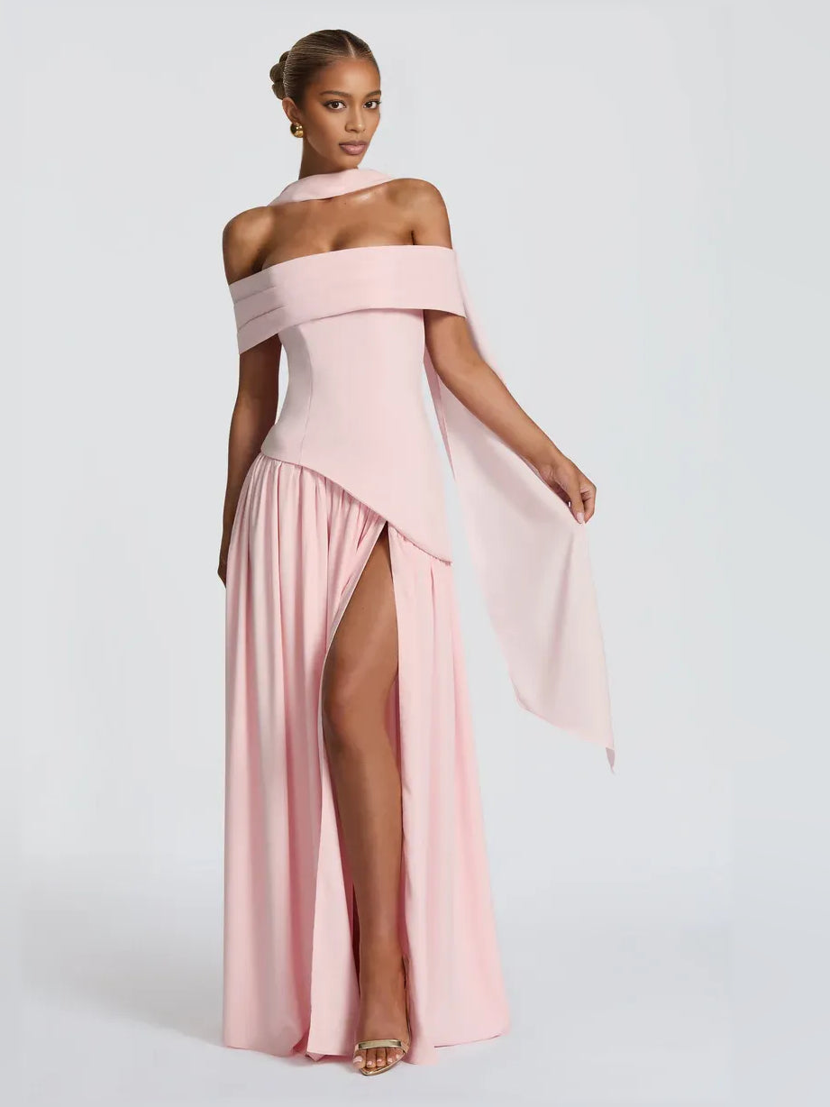 Off-shoulder blush pink pleated floor-length dress with front slit and sash drape
