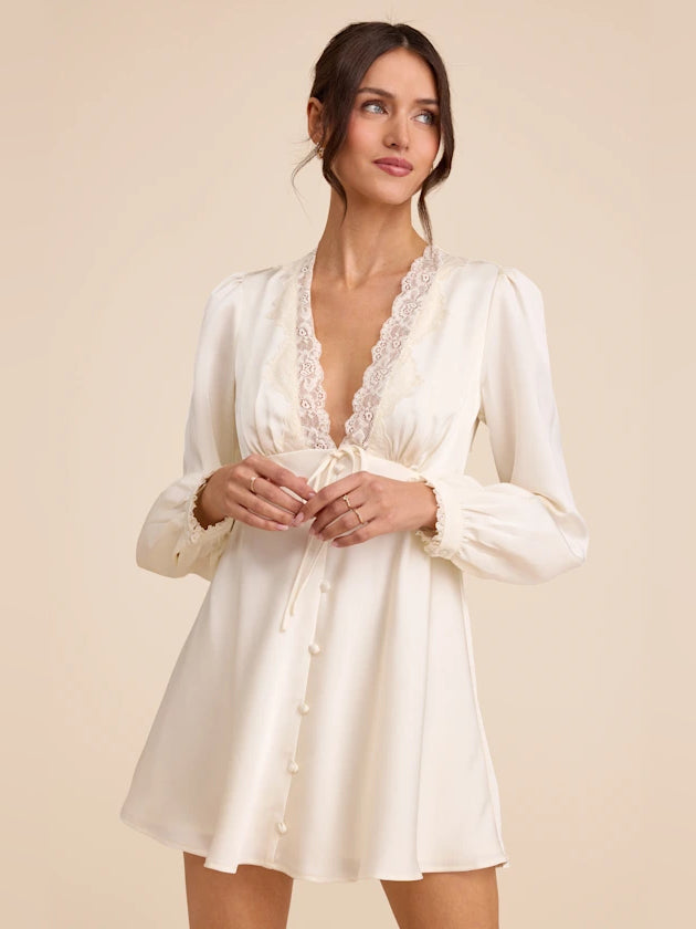 Ivory satin mini homecoming dress with long sleeves, lace V-neck, button front