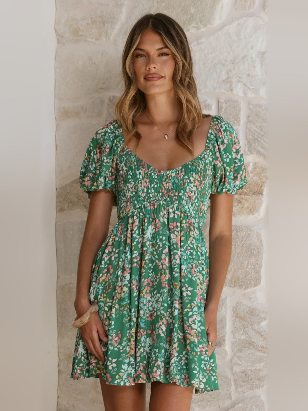 Green floral mini homecoming dress with puff sleeves and scoop neckline