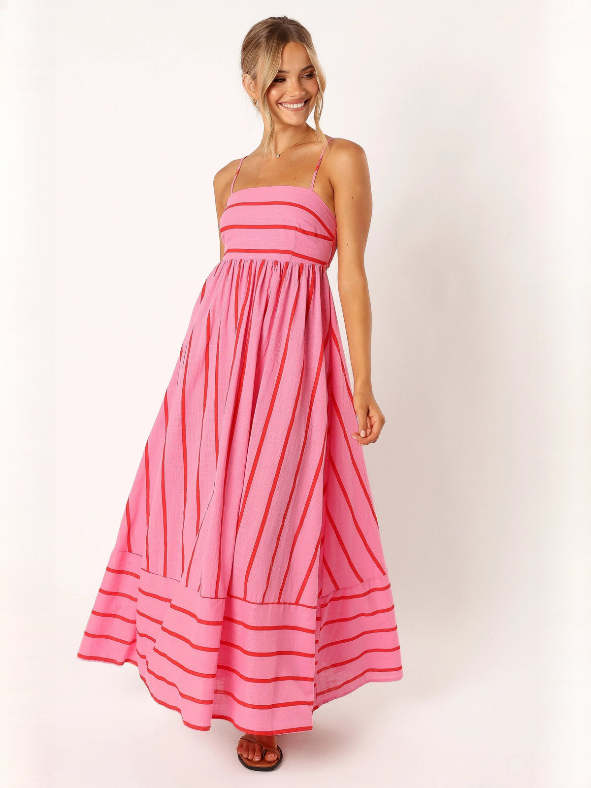 Red a-line maxi formal dress with strapless neckline, full-length front view