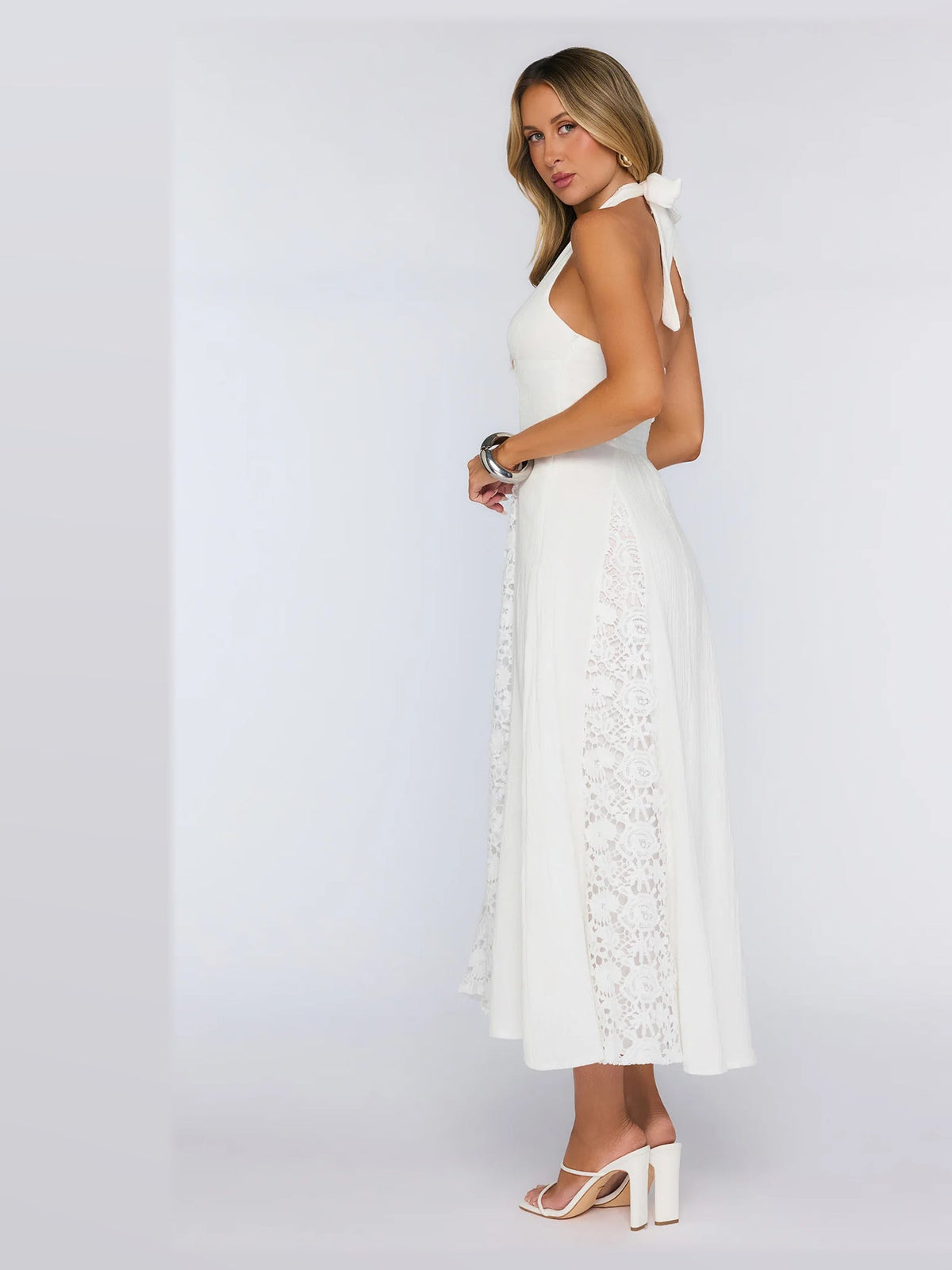White formal dress with a-line silhouette and maxi length