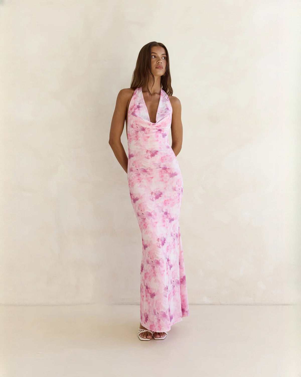 Pink floral halter neck A-line maxi dress with V neckline and long flowing skirt