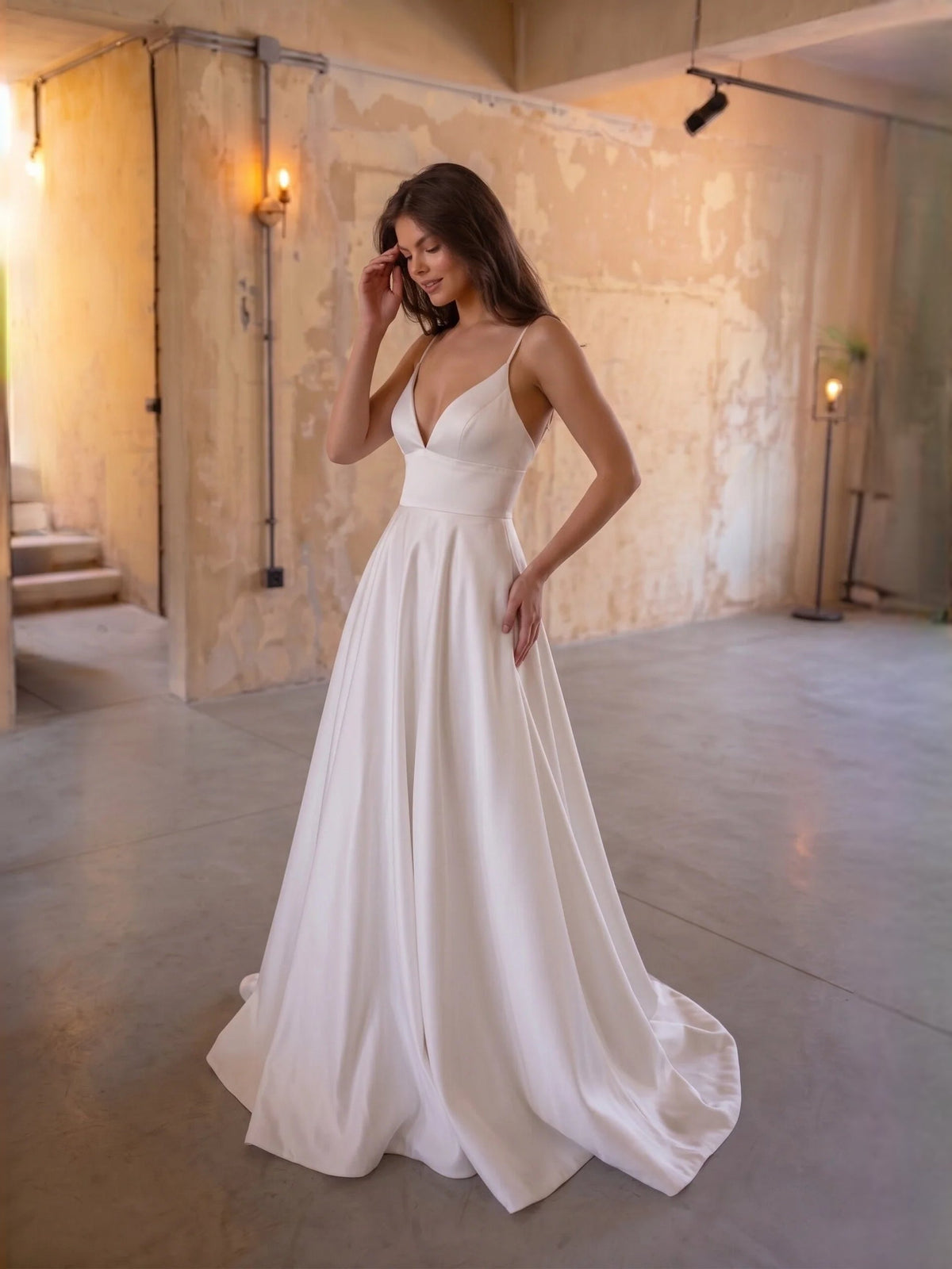 Ivory satin A-line wedding dress with draped V-neck bodice and flowing floor-length skirt