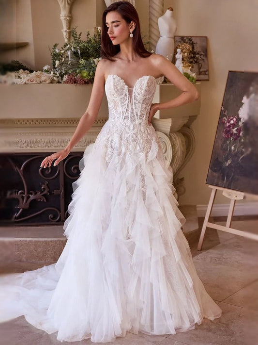 Ivory strapless sweetheart corset A-line tulle wedding dress with layered ruffles, floor-length