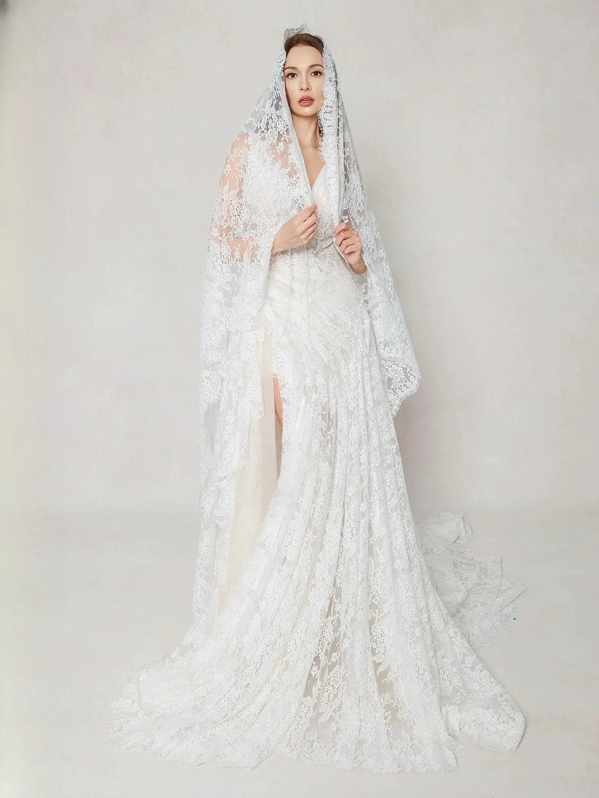 Ivory lace A-line wedding dress with V-neck, sleeveless bodice, thigh-high slit