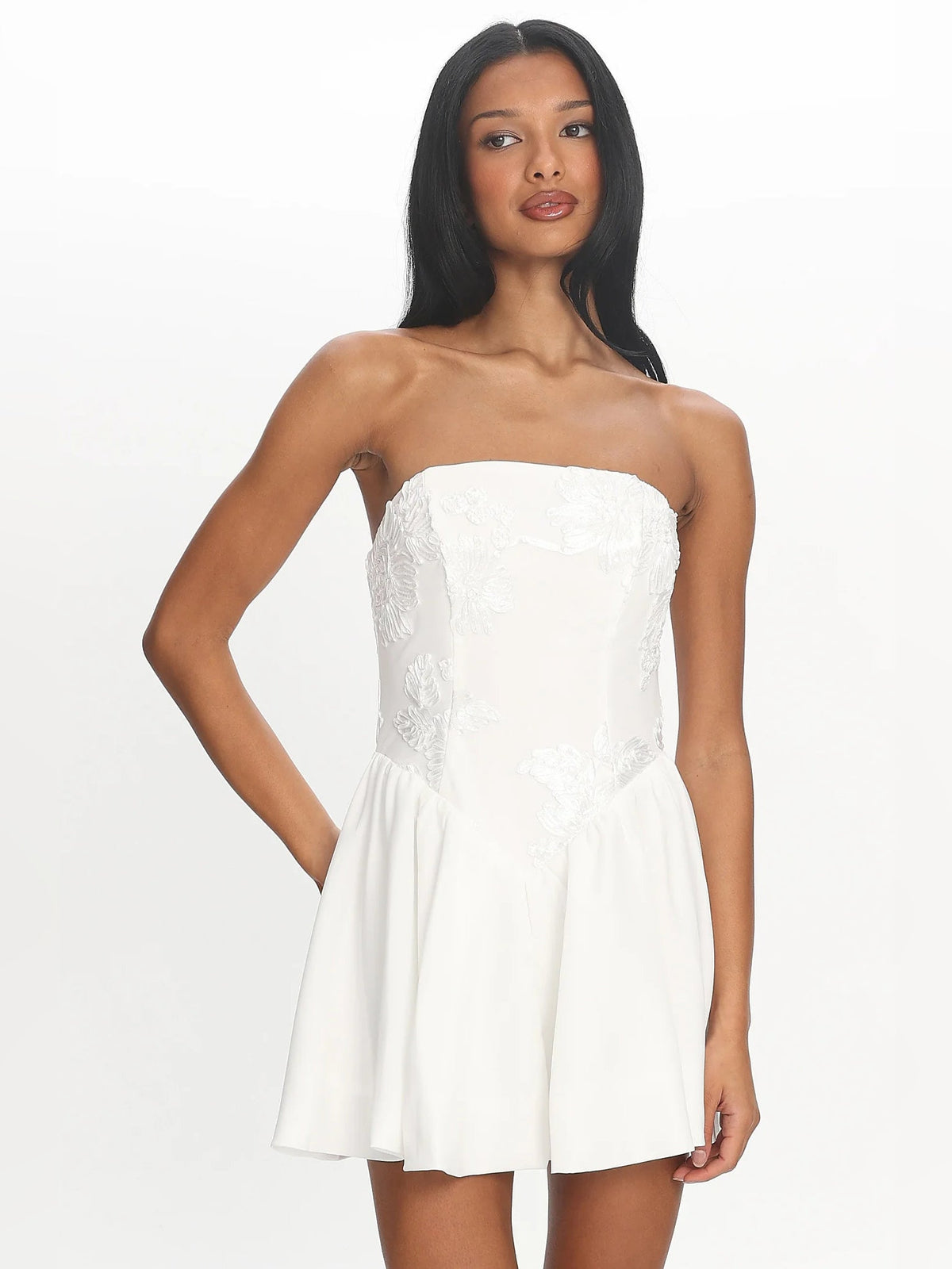 White strapless mini homecoming dress with textured bodice and pleated A-line skirt