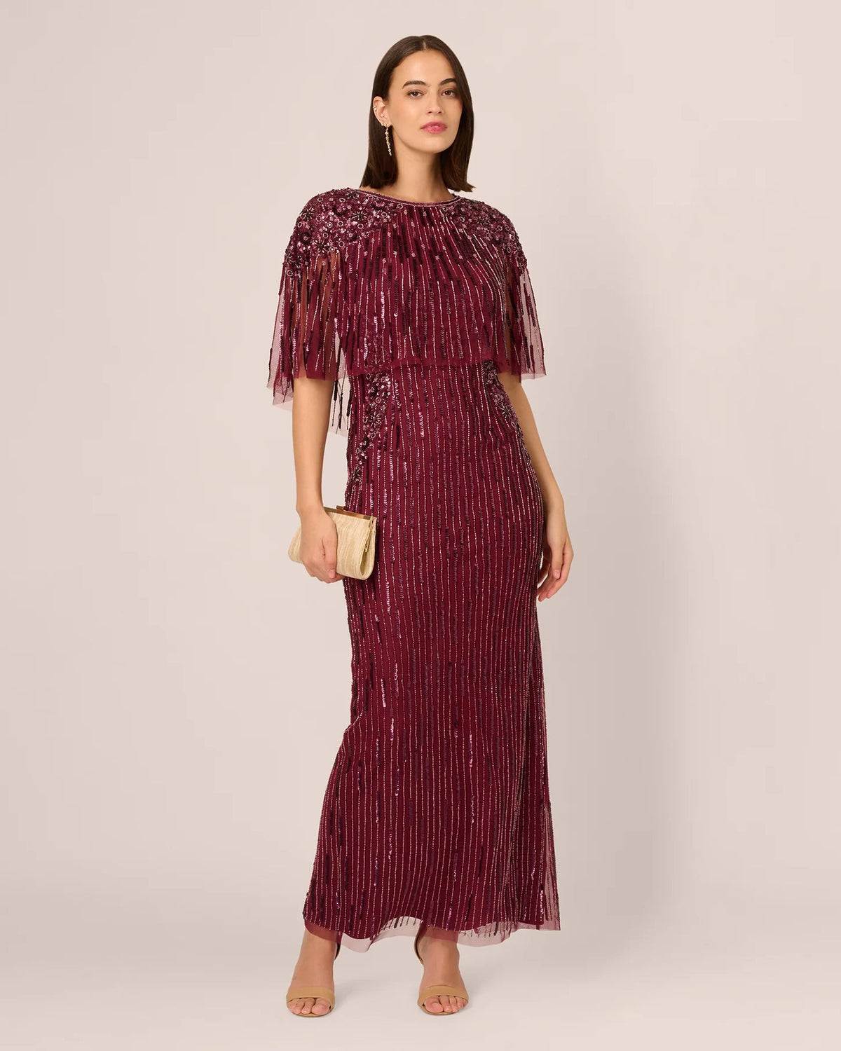 Burgundy sequin sheath maxi dress with fringe cape sleeves and boat neckline
