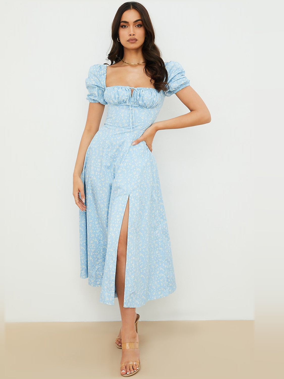 Light blue puff-sleeve midi dress with square neckline, ruched bodice, floral print