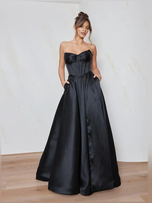 Black strapless sweetheart corset-style formal dress with full, floor-length skirt