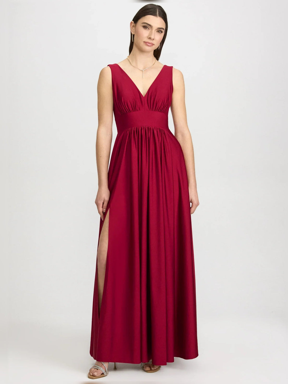 Red V-neck ruched floor-length formal dress with side slit, sleeveless design