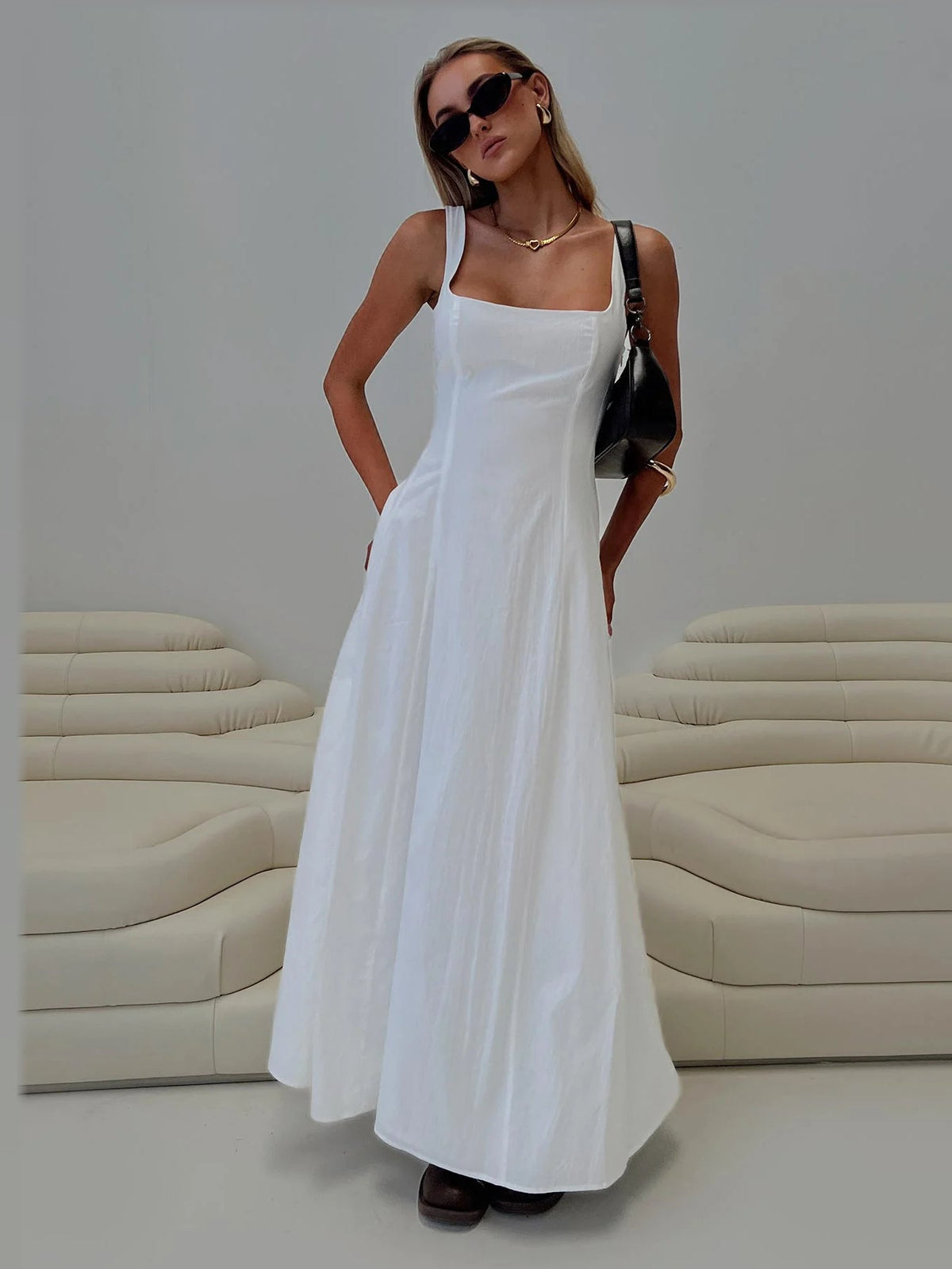 White formal dress with a-line silhouette and maxi length
