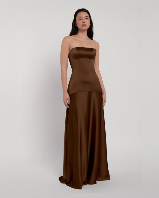 Strapless A-line satin maxi dress in chocolate brown, front view with layered skirt