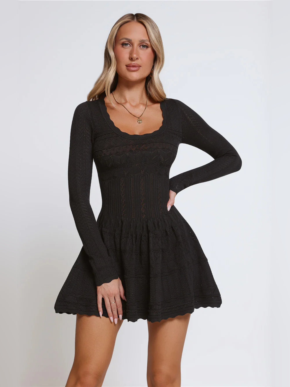 Black long-sleeve mini dress with square neckline and ruffled tiered skirt