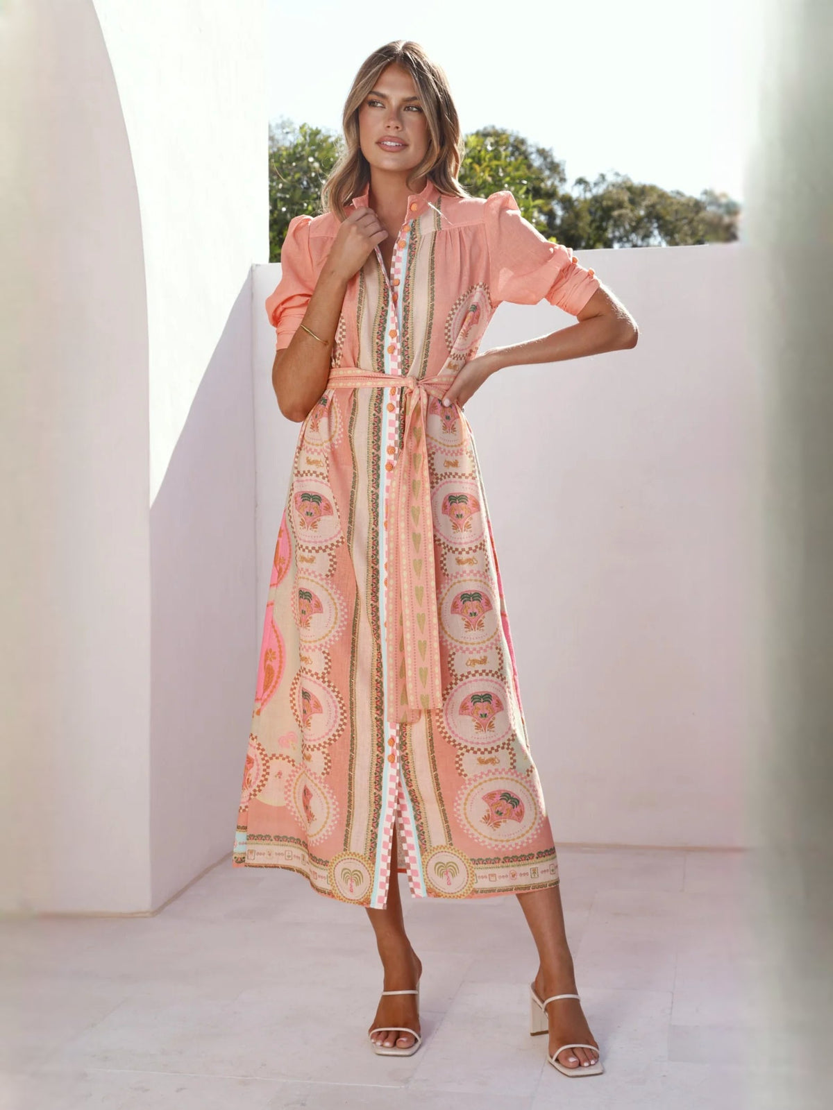 Peach midi formal dress with medallion print, tie waist, and ruffled V-neck detail