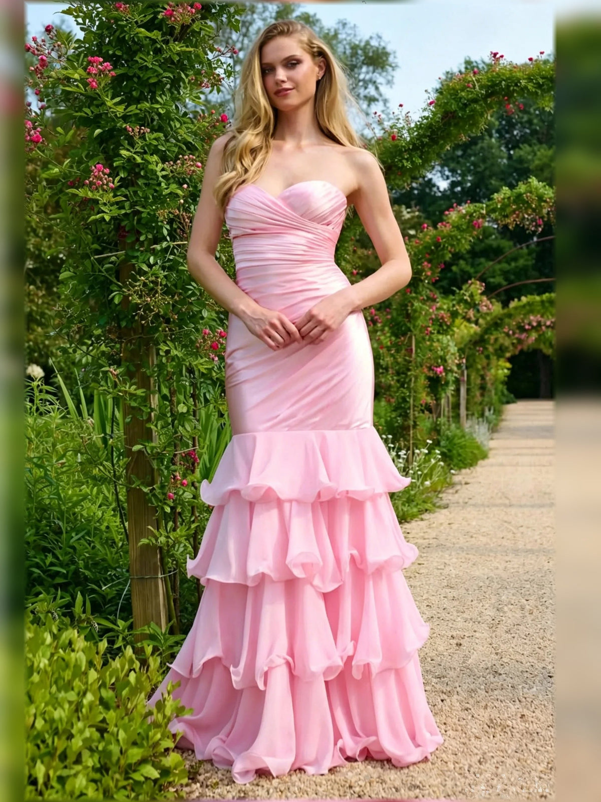 Pink sweetheart ruched formal gown with tiered ruffle skirt, sleeveless, floor length