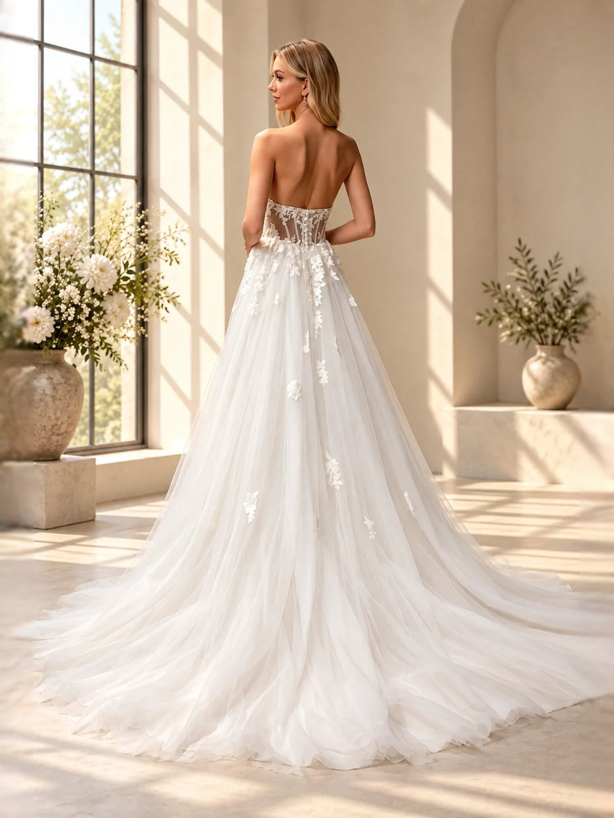 Ivory corset-style wedding dress with floral applique, A-line skirt and open back