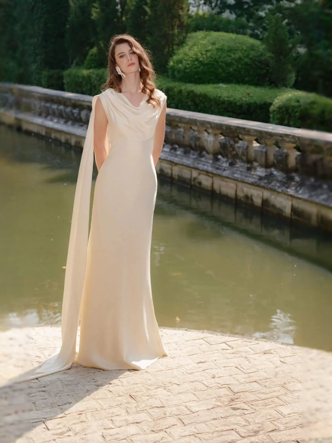 Ivory satin sheath wedding dress with draped cowl neckline and floor-length skirt
