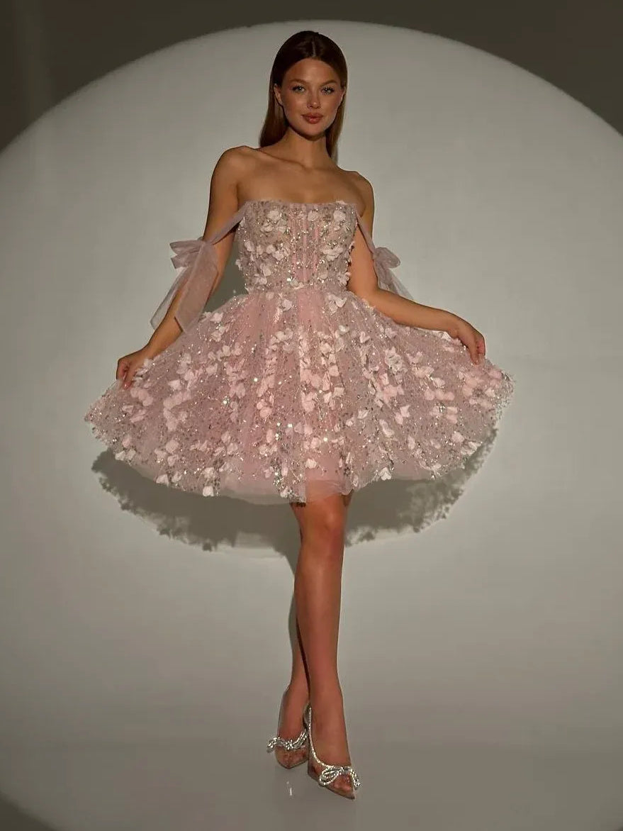 Blush pink off-shoulder corset mini tulle dress with floral appliques and bow accents