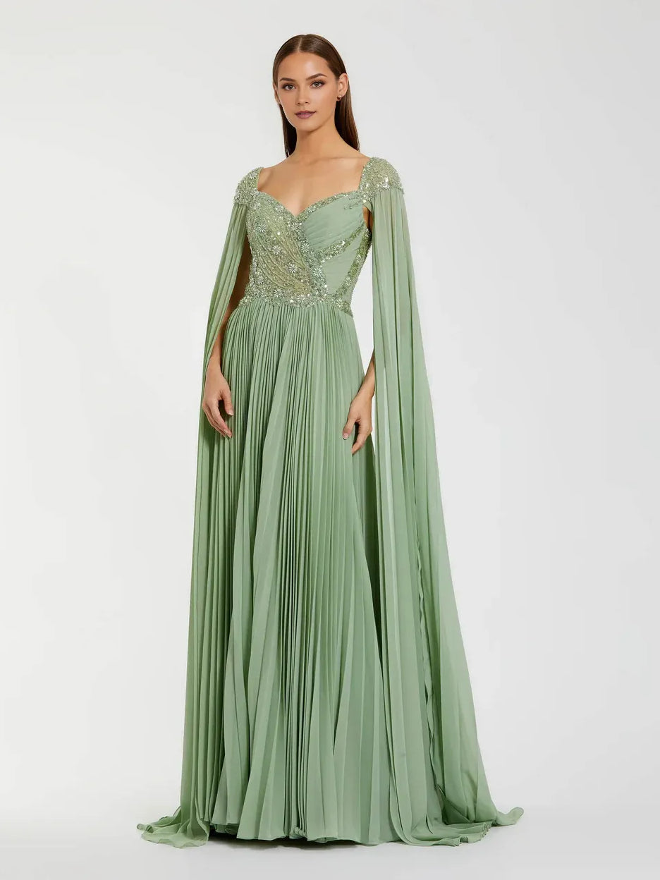 Dusty sage formal dress with sweetheart neckline, beaded bodice, pleated skirt, cape sleeves