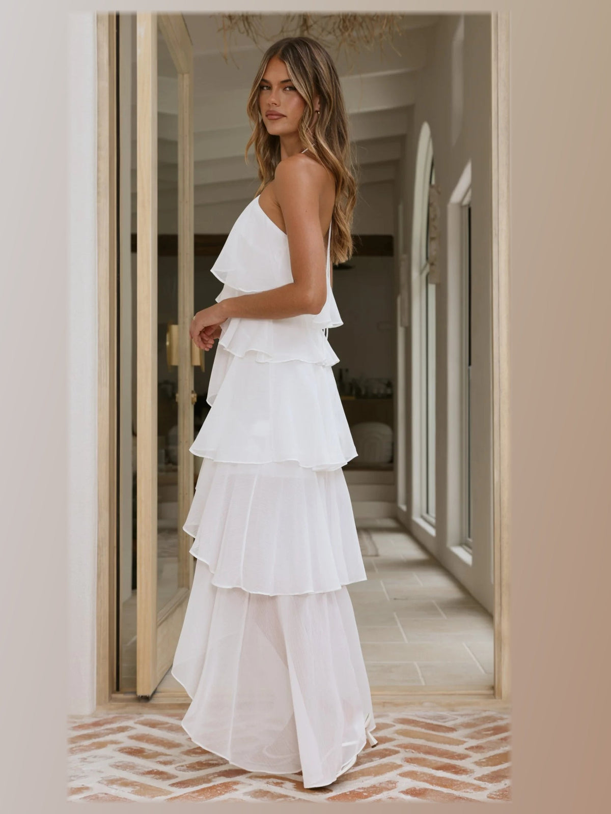 White formal dress with a-line silhouette and maxi length