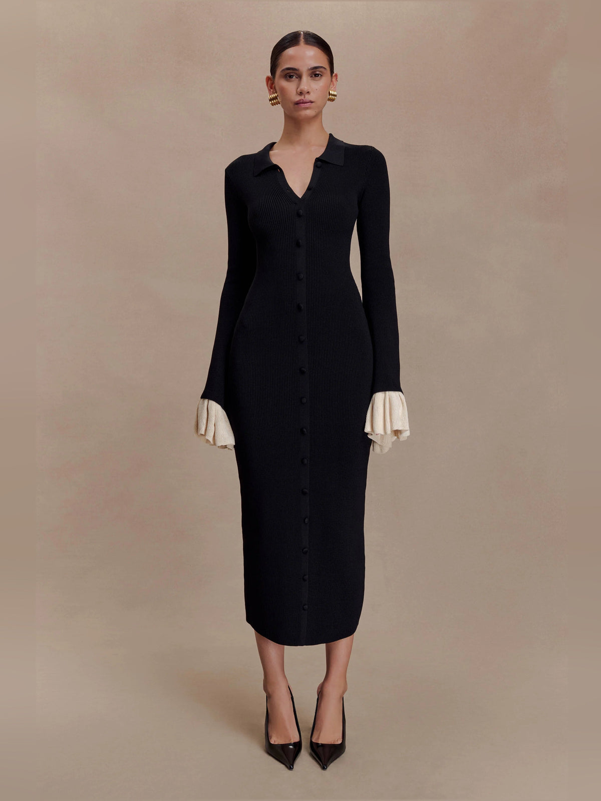 Amirose black knit midi dress, button-front, long sleeves, cream ruffle cuffs