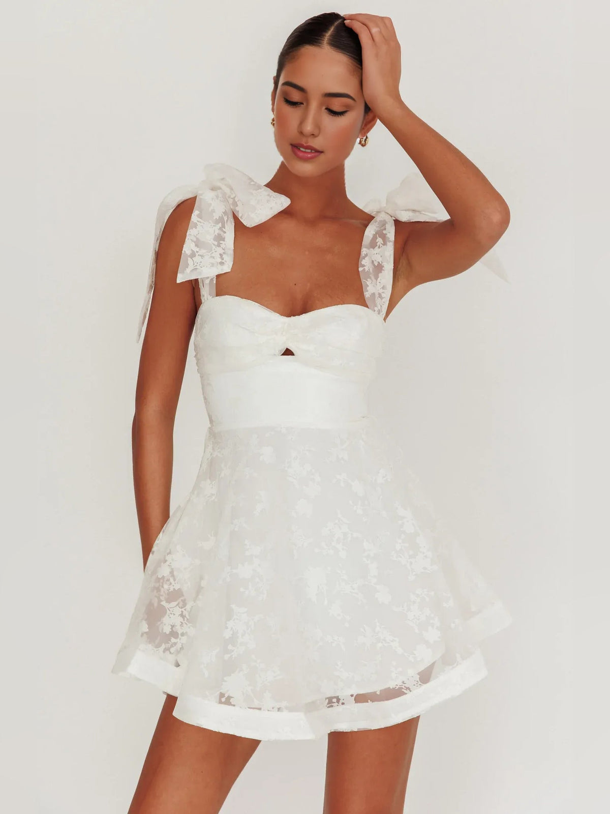 Ivory sweetheart A-line mini dress with organza floral texture and bow shoulder sleeves
