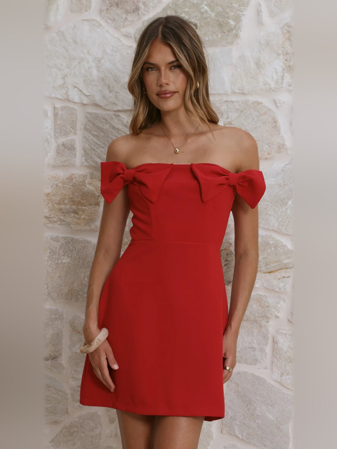 Red off-shoulder mini homecoming dress with bow sleeves and fitted bodice