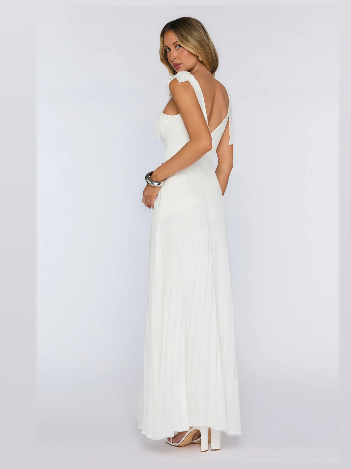 White formal dress with a-line silhouette and maxi length
