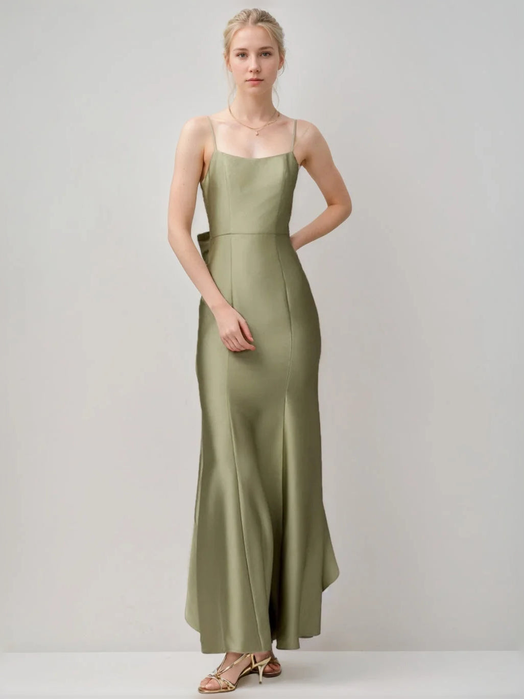 Dusty sage satin sheath dress with square neckline and pleated floor-length hem.