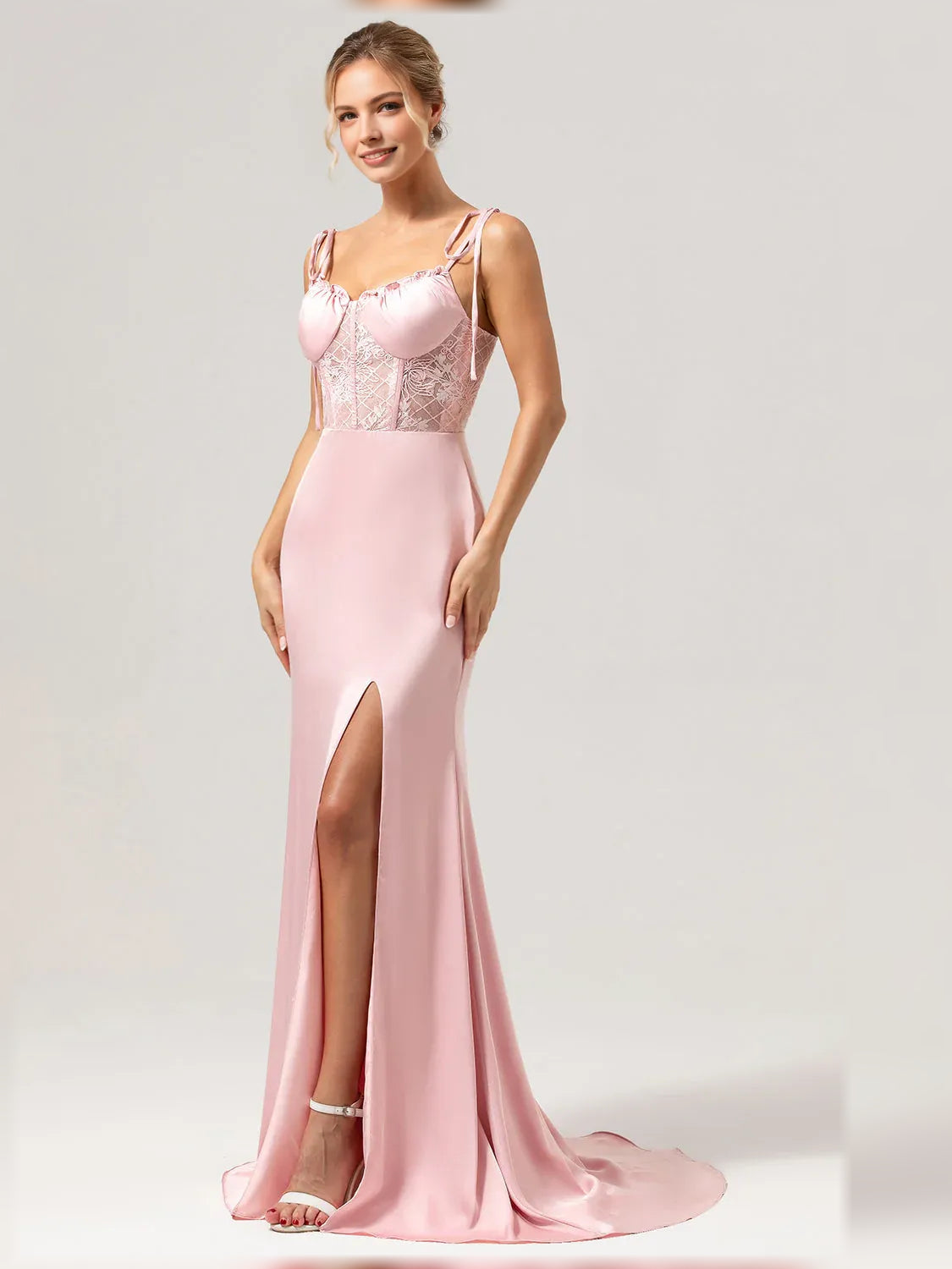 Light pink V-neck corset-style formal dress with embellished bodice and thigh slit