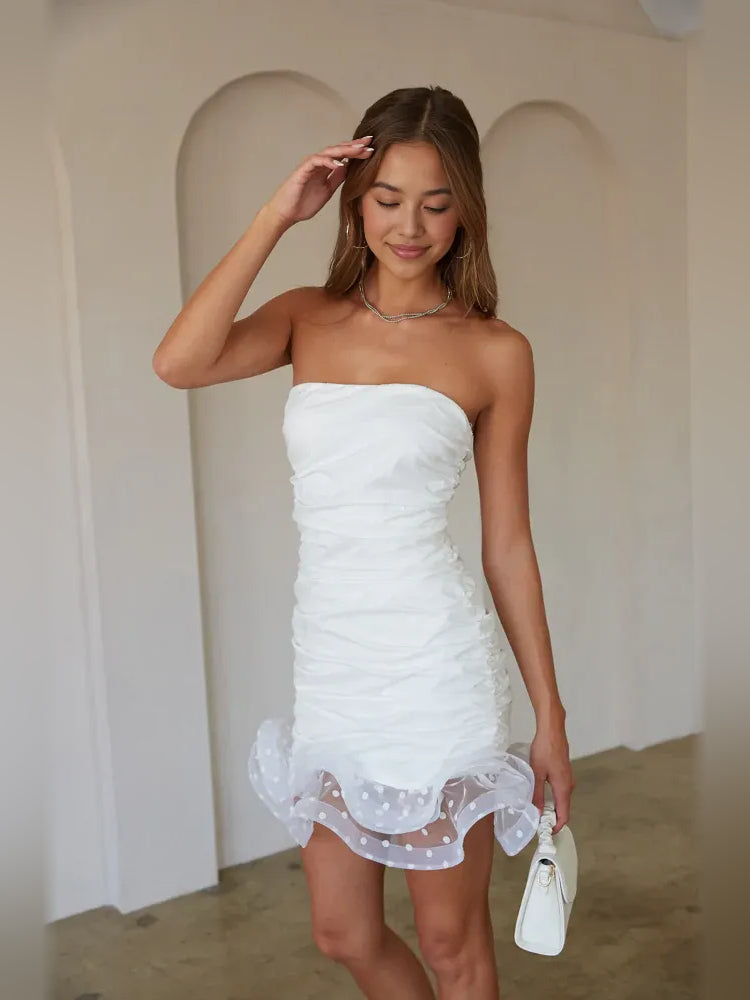 White strapless ruched bodycon mini dress with layered ruffle hem