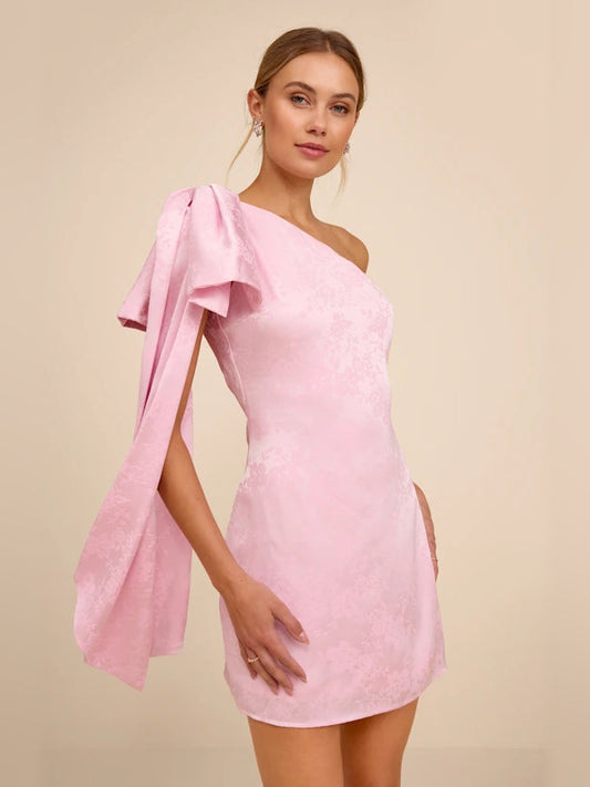 Light pink one-shoulder satin mini dress with draped bow detail