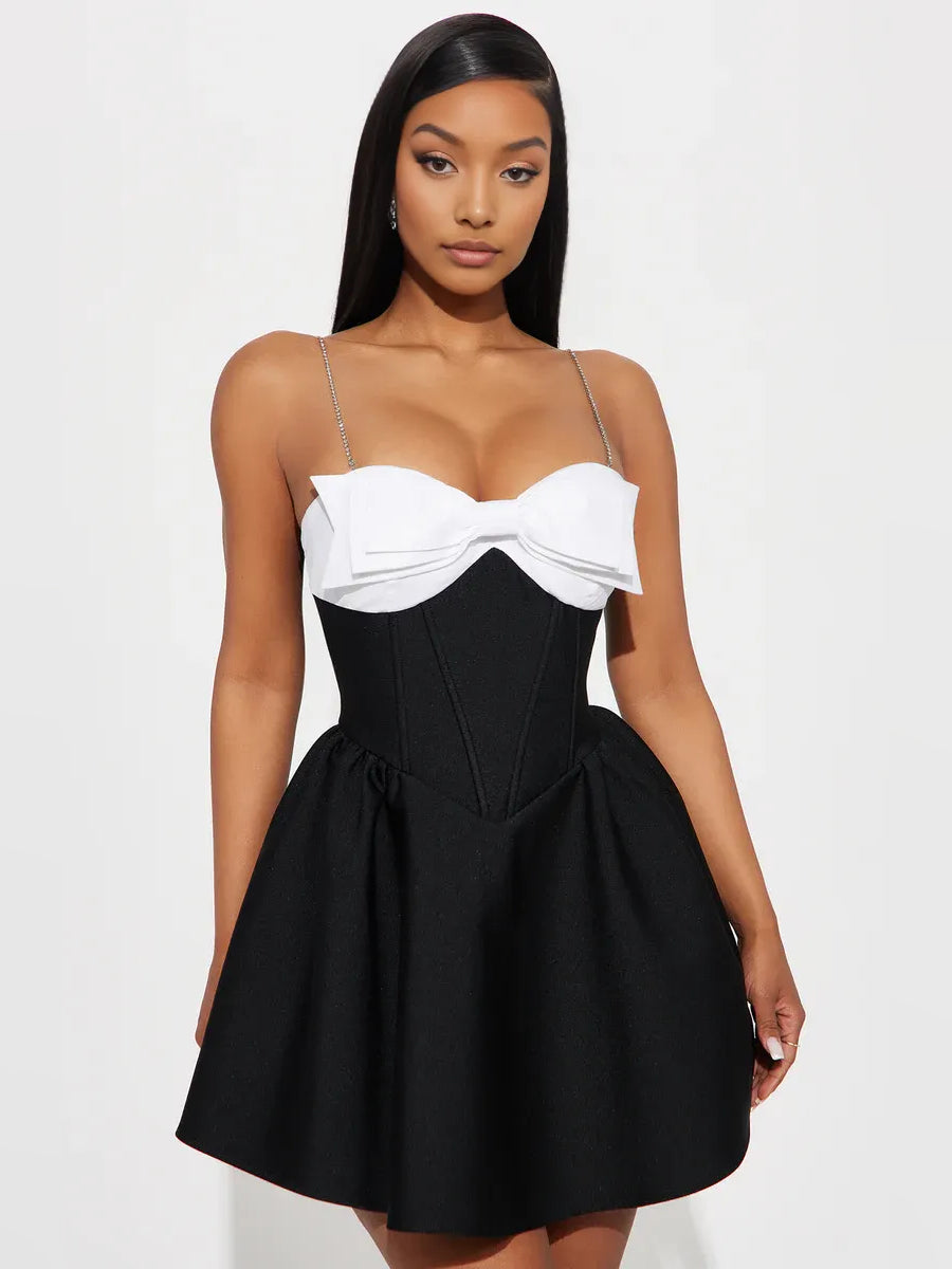 Sweetheart corset mini dress with white bodice and black A-line skirt, bow at waist