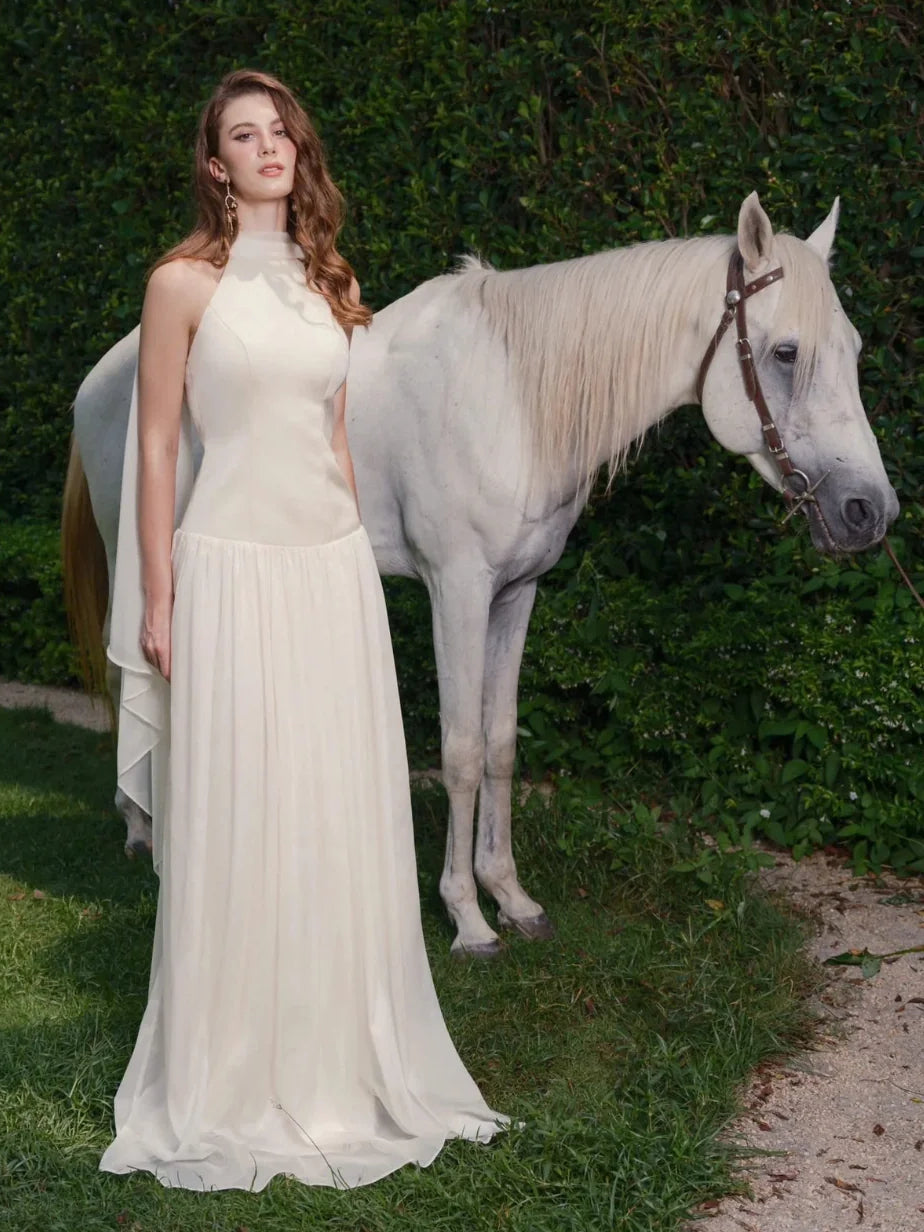 Ivory chiffon halter wedding dress with draped bodice and A-line floor length skirt