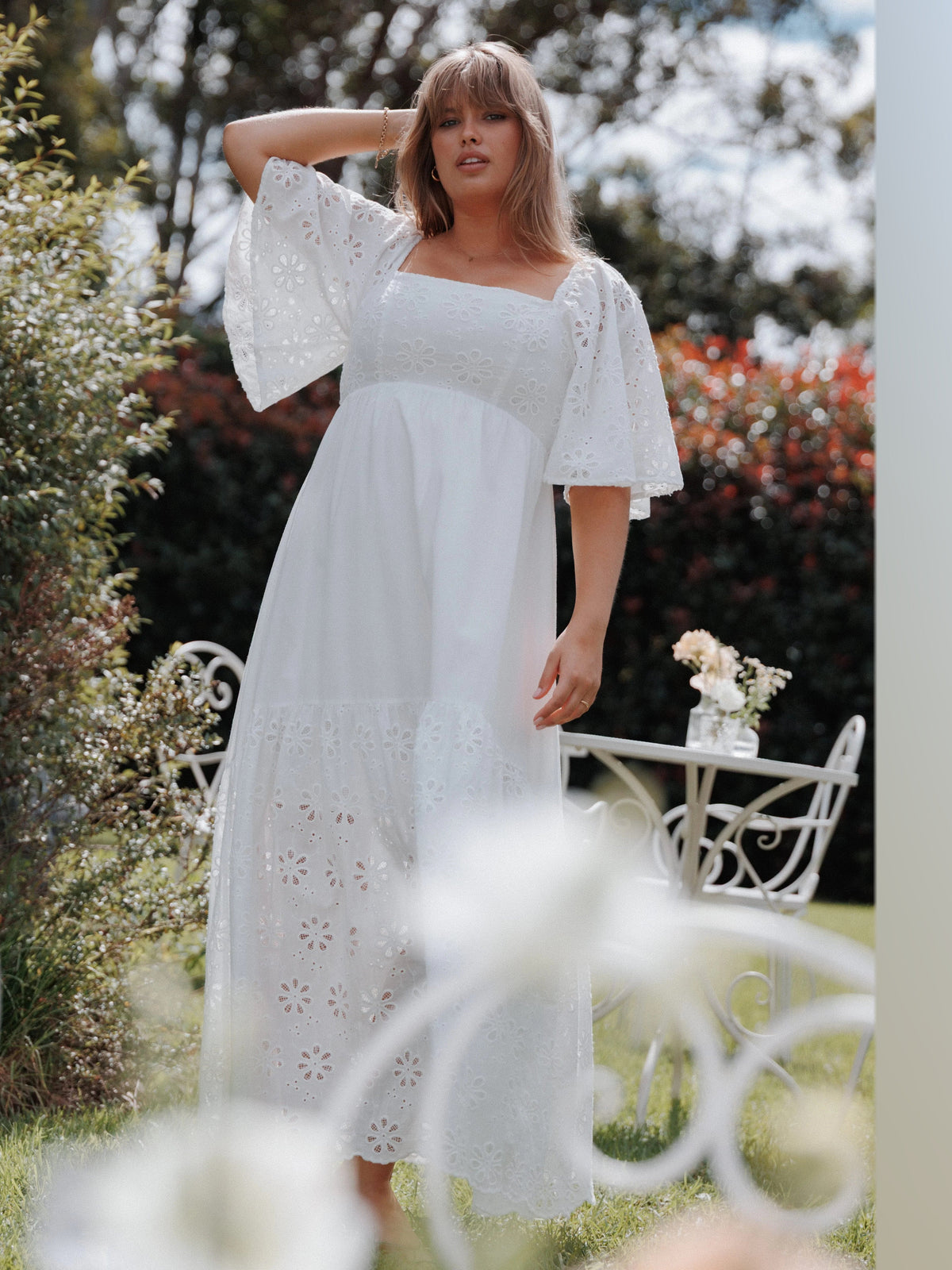White formal dress with a-line silhouette and maxi length