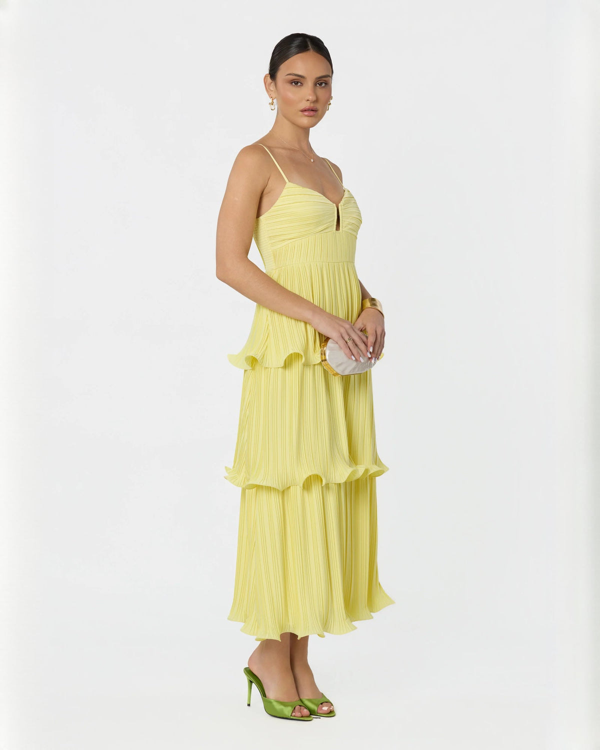 Light yellow sleeveless tiered A-line maxi dress with V-neck bodice and layered skirt