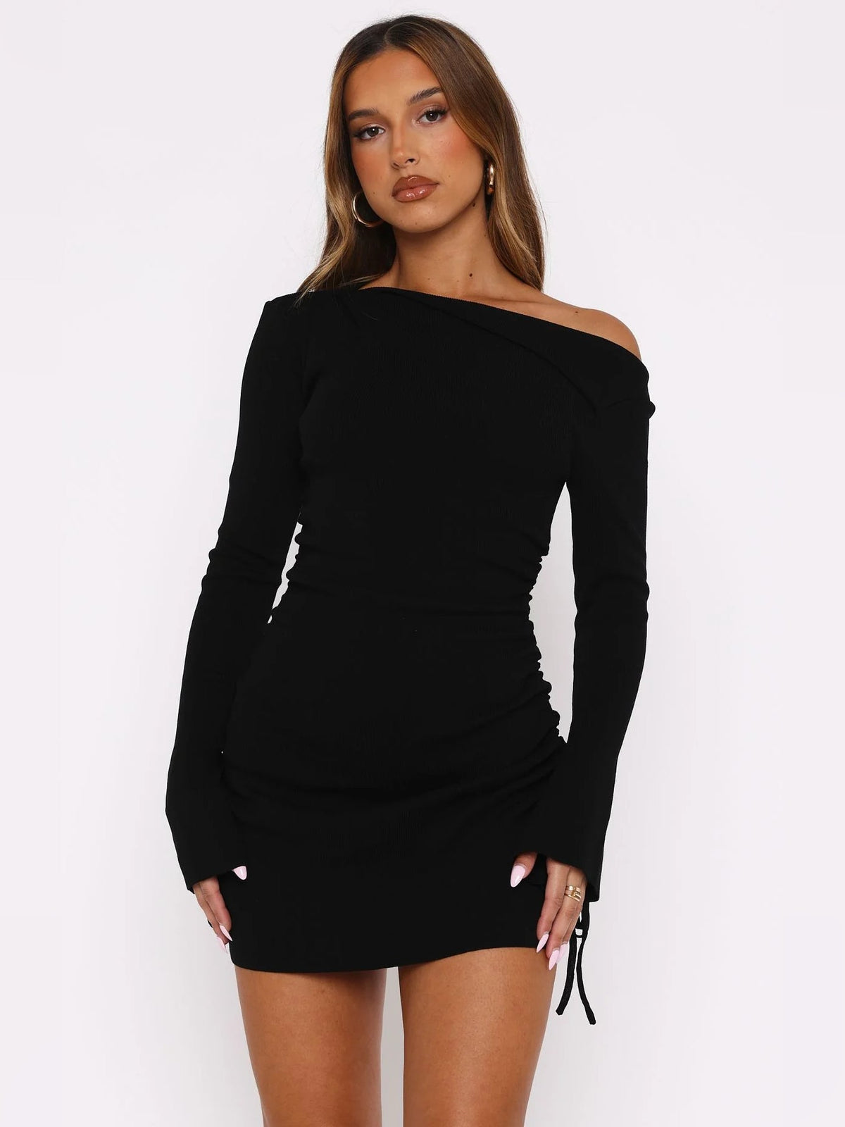 Black long-sleeve mini dress with ruched waist and off-shoulder neckline