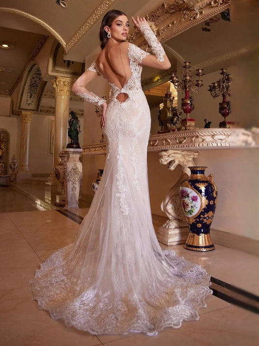 Ivory lace mermaid wedding dress with deep V neckline and long sheer sleeves