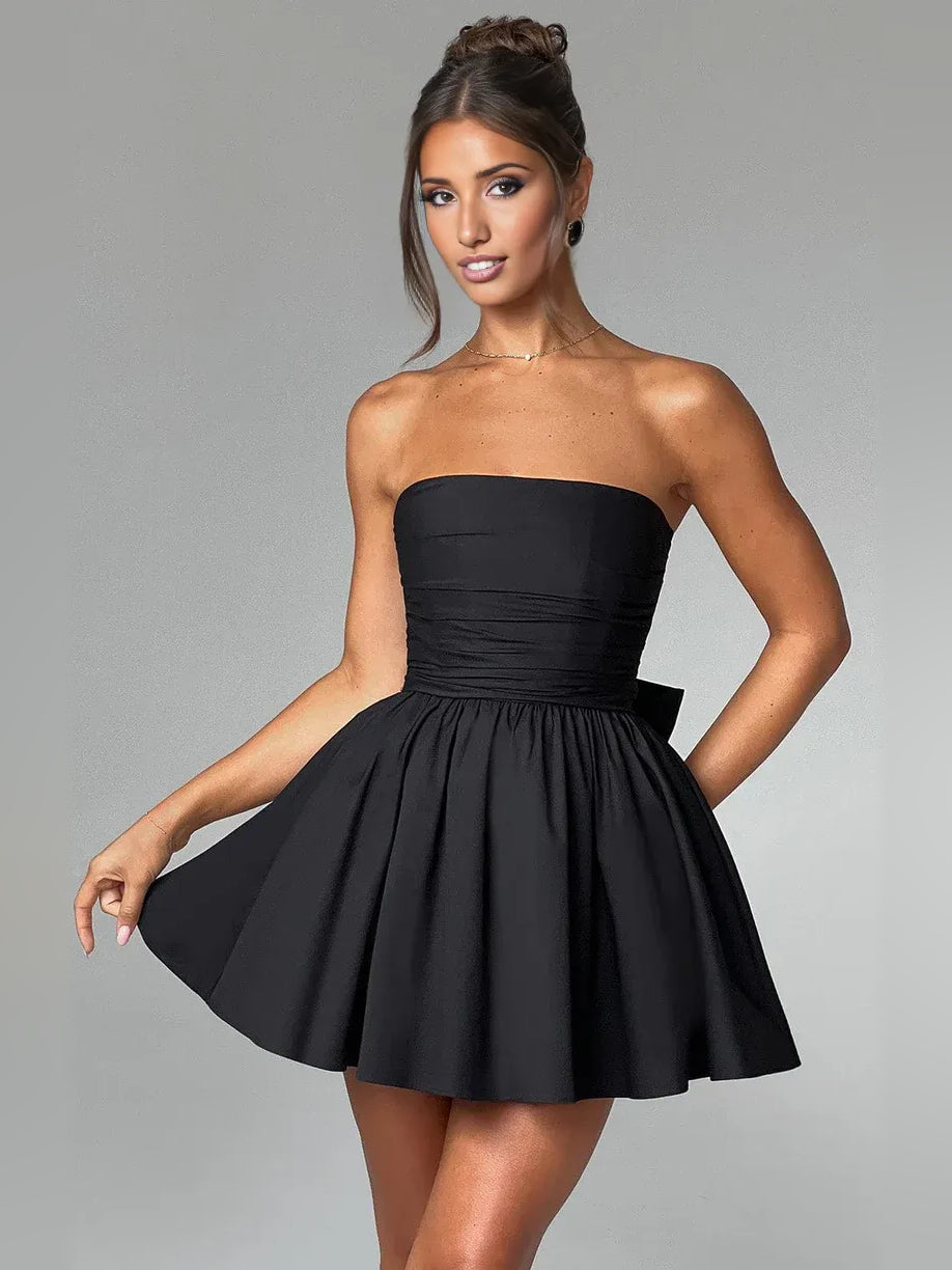 Black strapless mini A-line dress with ruched bodice and flared skirt.