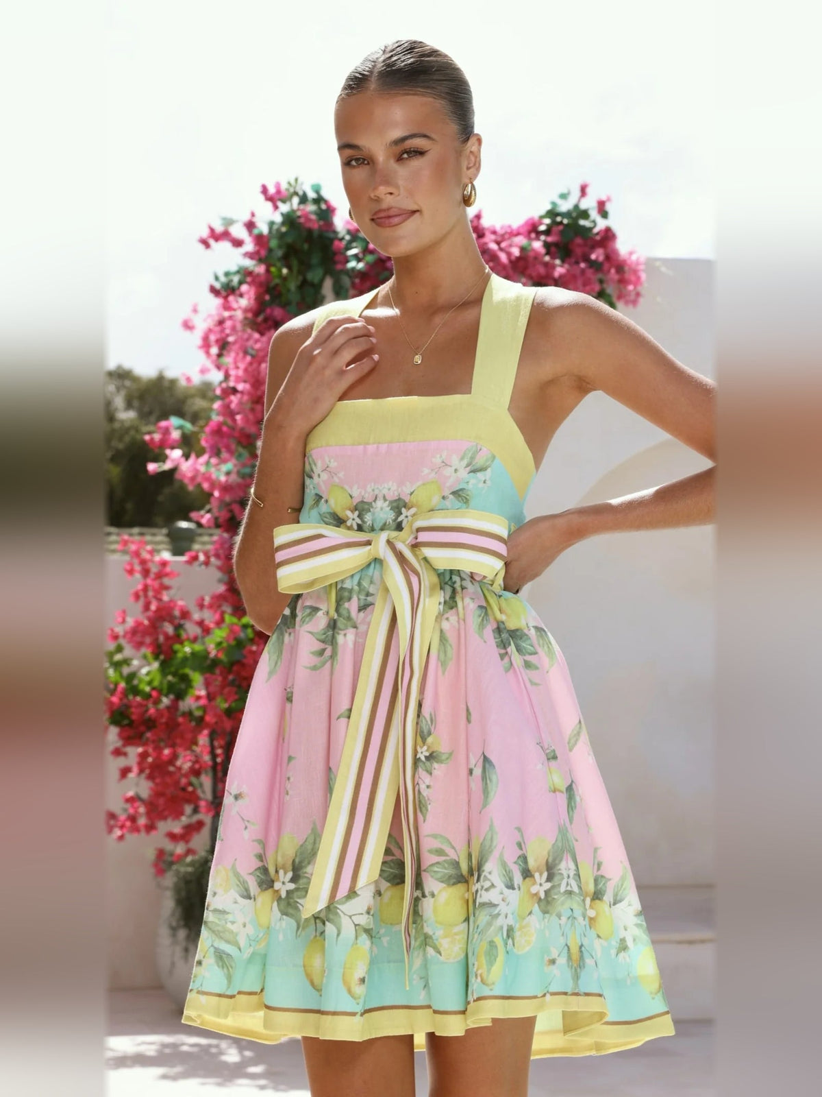 Pastel lemon print mini dress, sleeveless with square neckline and striped bow-tie waist
