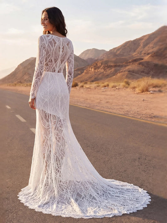 Ivory lace mermaid wedding dress with scoop neck, long sleeves, scalloped hem.