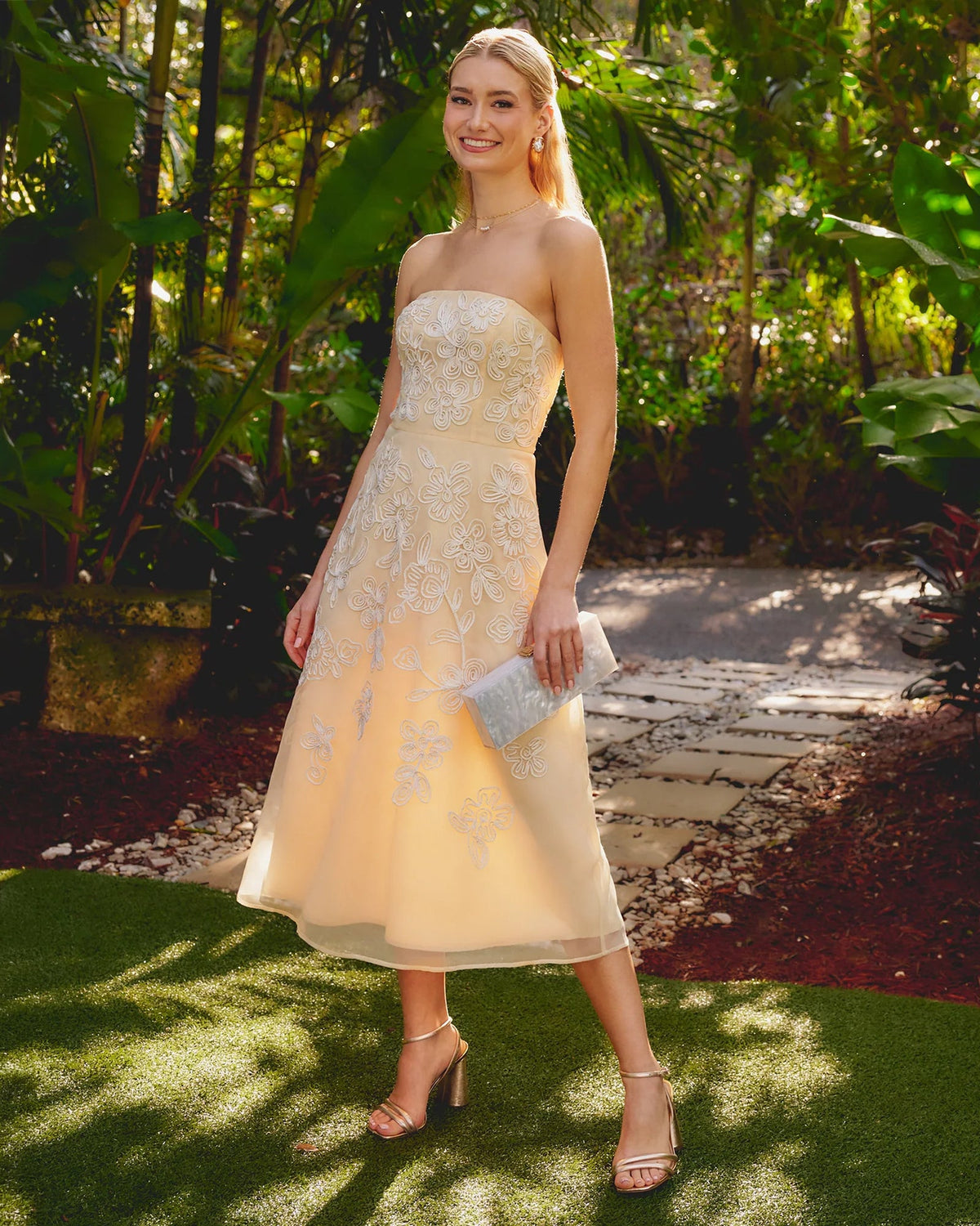 Pale yellow strapless A-line midi dress with embroidered floral appliques
