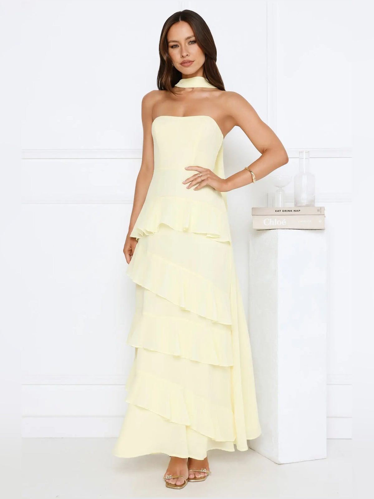 Yellow a-line maxi formal dress with strapless neckline, full-length front view
