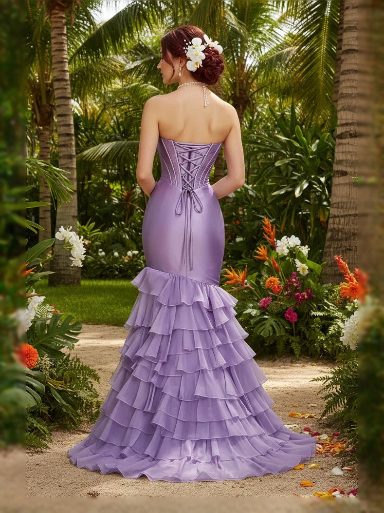 Light purple satin strapless corset prom dress with tiered ruffle mermaid skirt, back view
