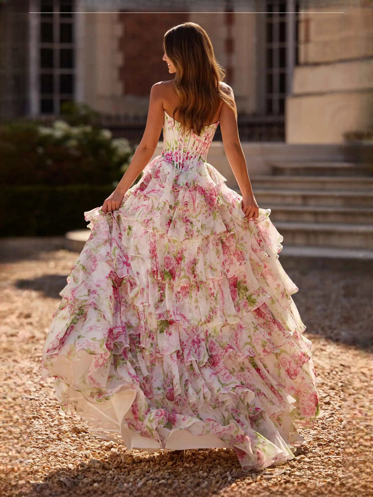 Floral tiered corset maxi prom dress with ruffled tiers, light pink back view